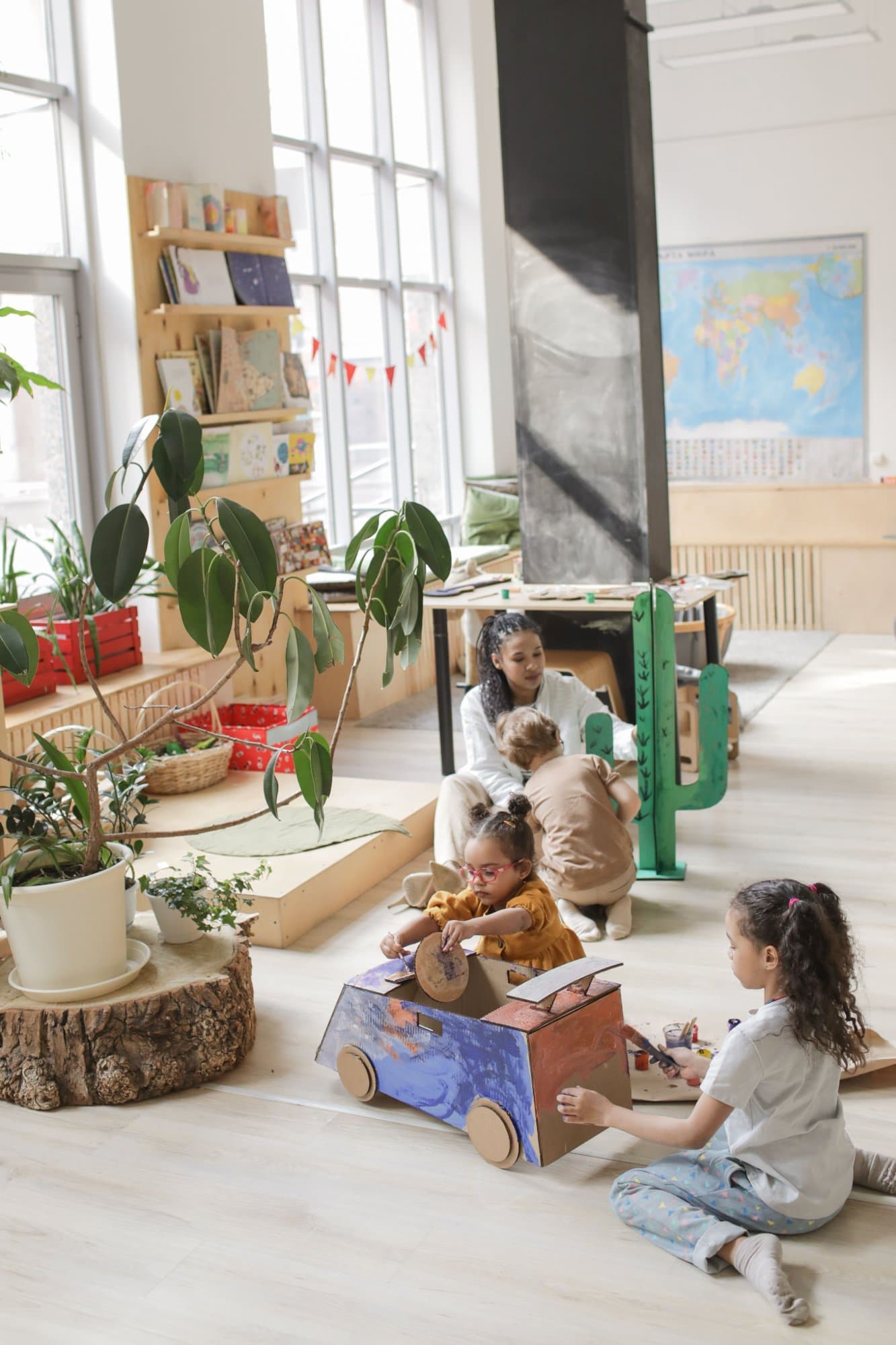 An educator, fully present with a child mid-play